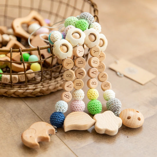 BabyCarrier Schnullerhalter Blumen - Holz 22cm Name