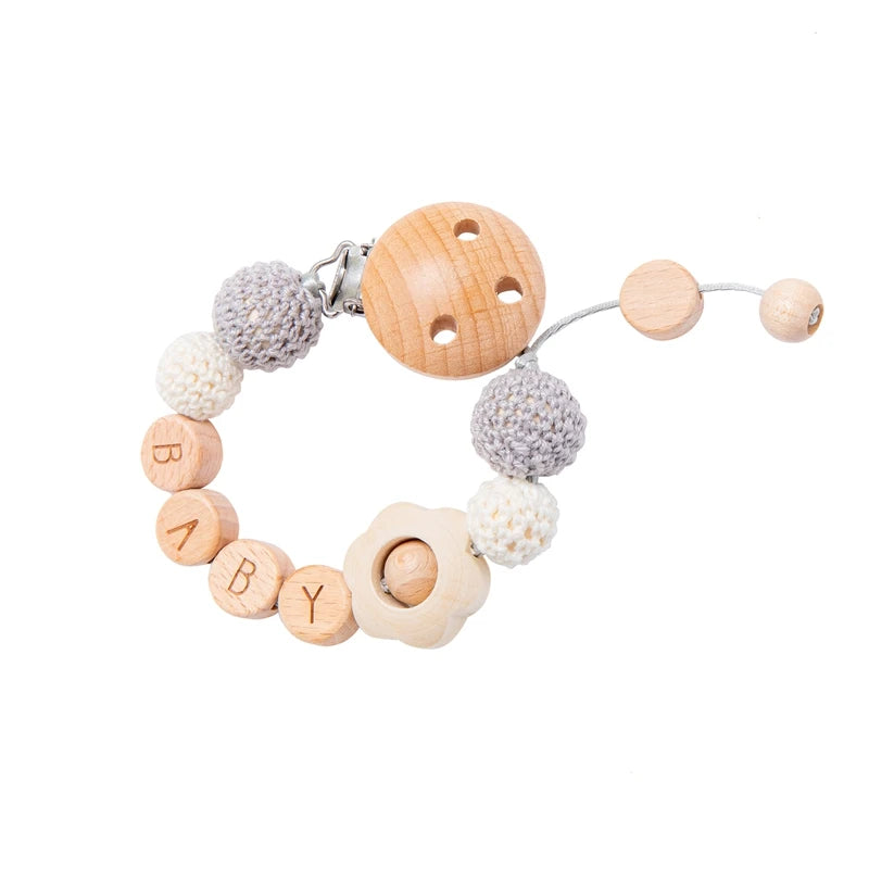 BabyCarrier Schnullerhalter Blumen - Holz 22cm Name