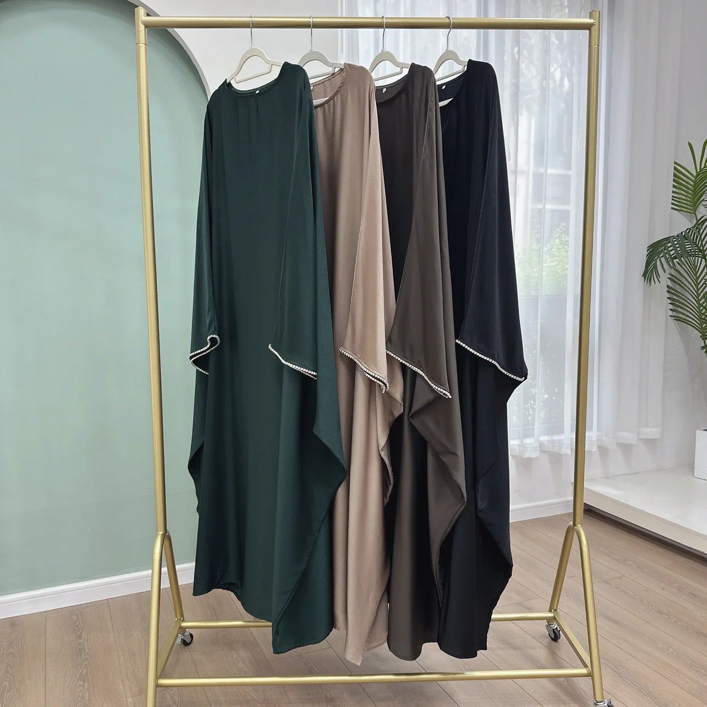 Saudi Arabian and Turkish women's dresses made of matte satin with bead embellishments for spring and summer gatherings