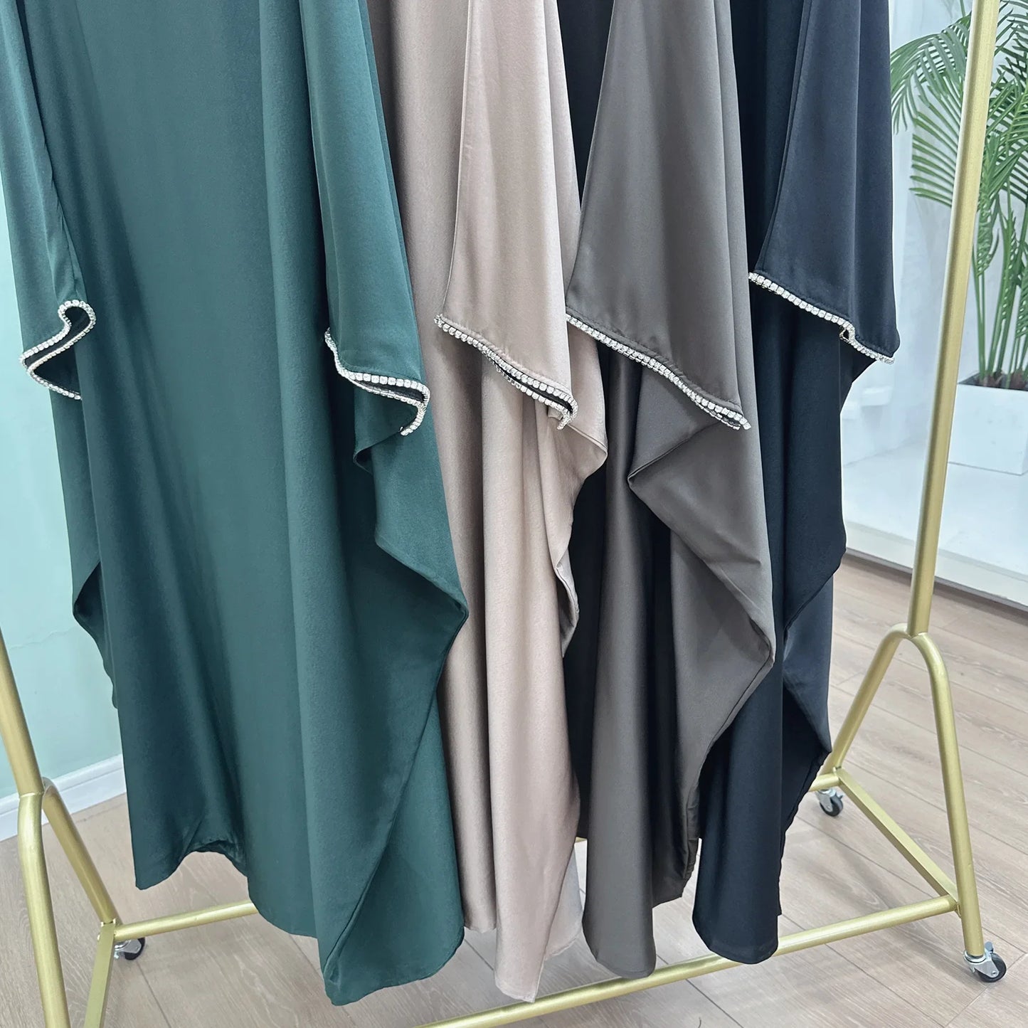 Saudi Arabian and Turkish women's dresses made of matte satin with bead embellishments for spring and summer gatherings