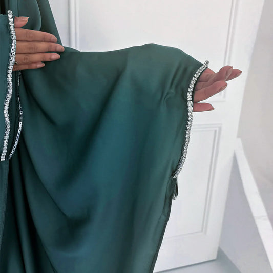 Saudi Arabian and Turkish women's dresses made of matte satin with bead embellishments for spring and summer gatherings
