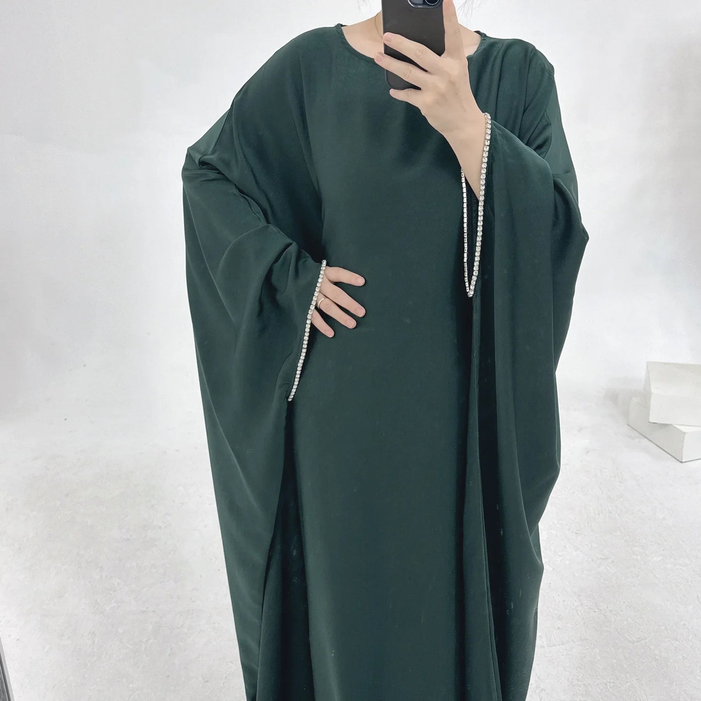 Saudi Arabian and Turkish women's dresses made of matte satin with bead embellishments for spring and summer gatherings