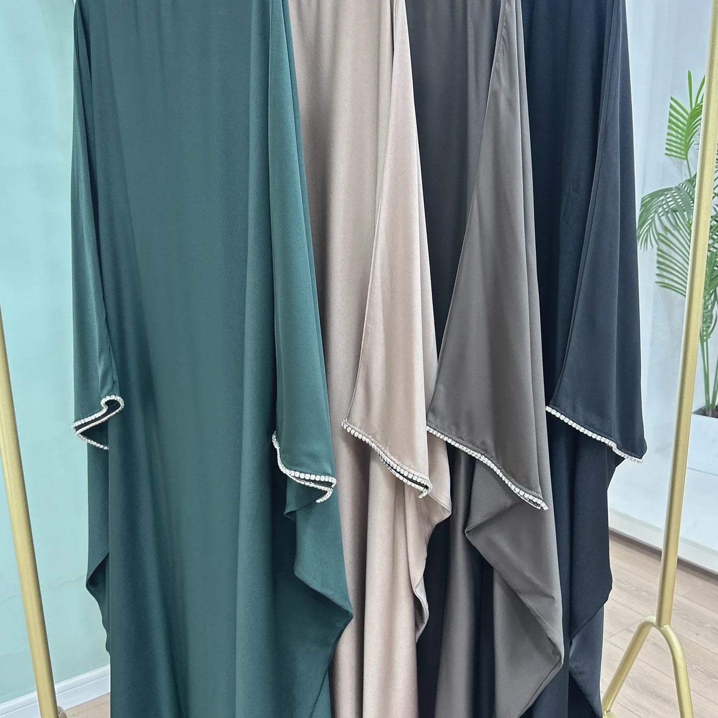 Saudi Arabian and Turkish women's dresses made of matte satin with bead embellishments for spring and summer gatherings