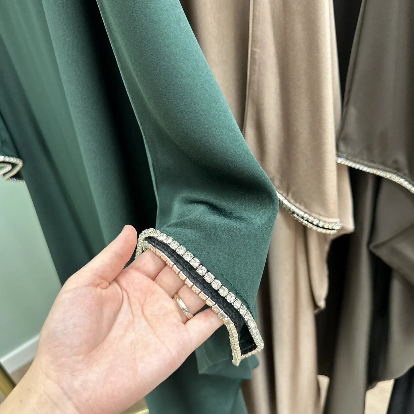 Saudi Arabian and Turkish women's dresses made of matte satin with bead embellishments for spring and summer gatherings