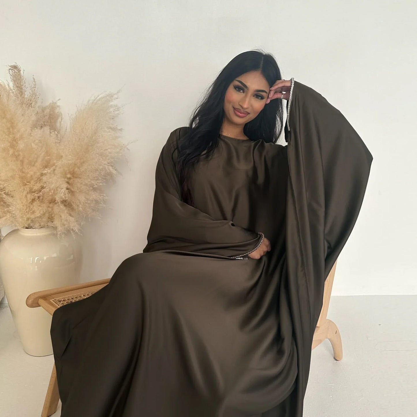 Saudi Arabian and Turkish women's dresses made of matte satin with bead embellishments for spring and summer gatherings