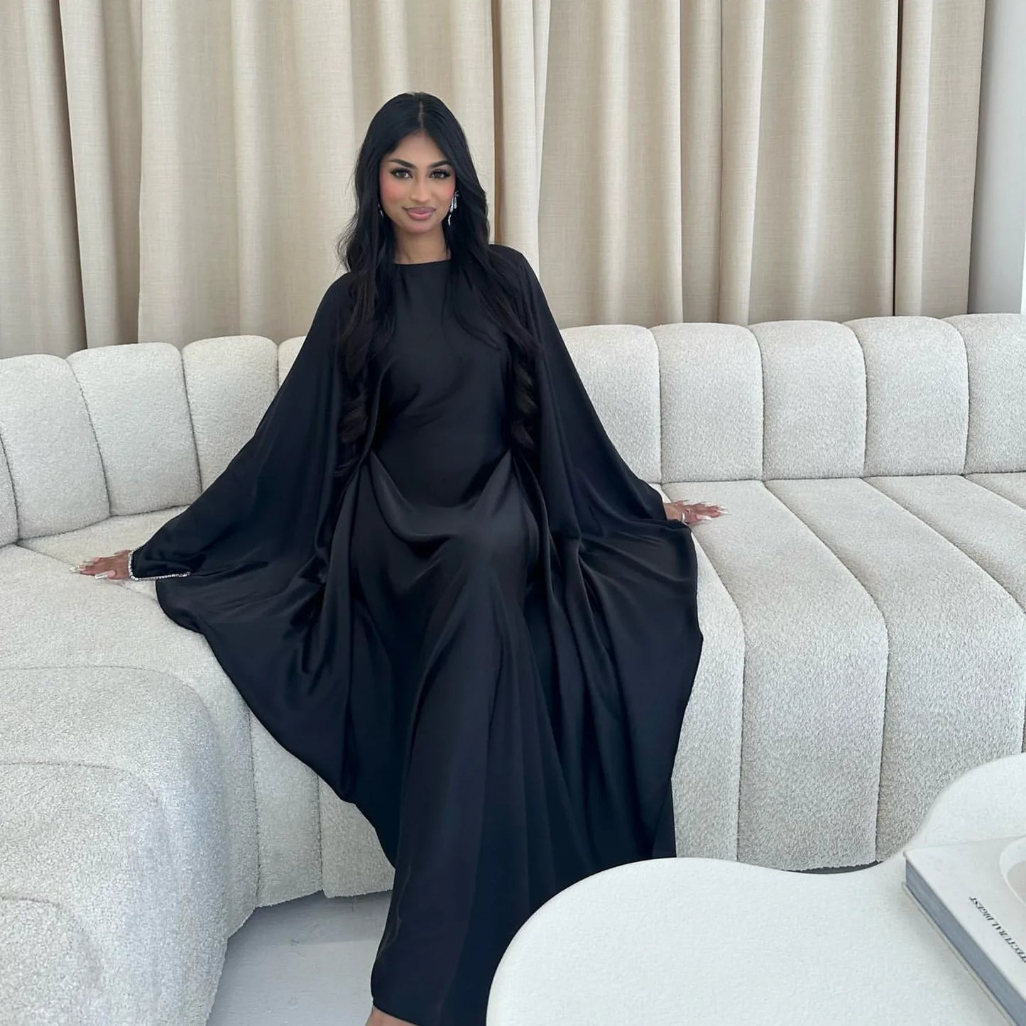 Saudi Arabian and Turkish women's dresses made of matte satin with bead embellishments for spring and summer gatherings
