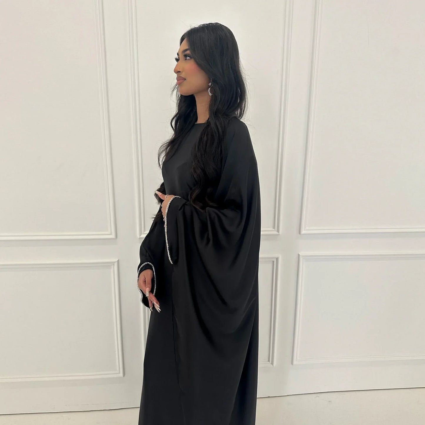 Saudi Arabian and Turkish women's dresses made of matte satin with bead embellishments for spring and summer gatherings
