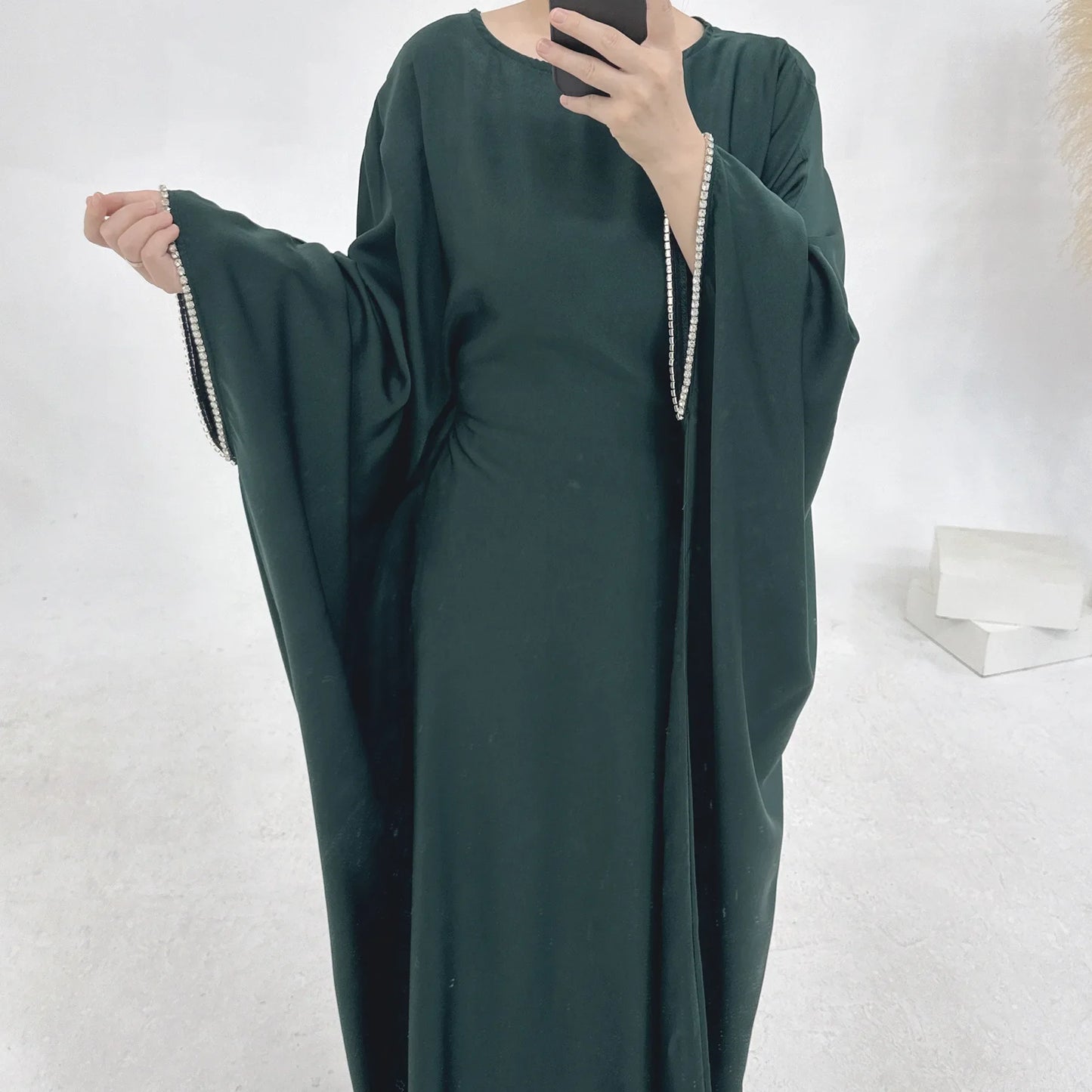 Saudi Arabian and Turkish women's dresses made of matte satin with bead embellishments for spring and summer gatherings